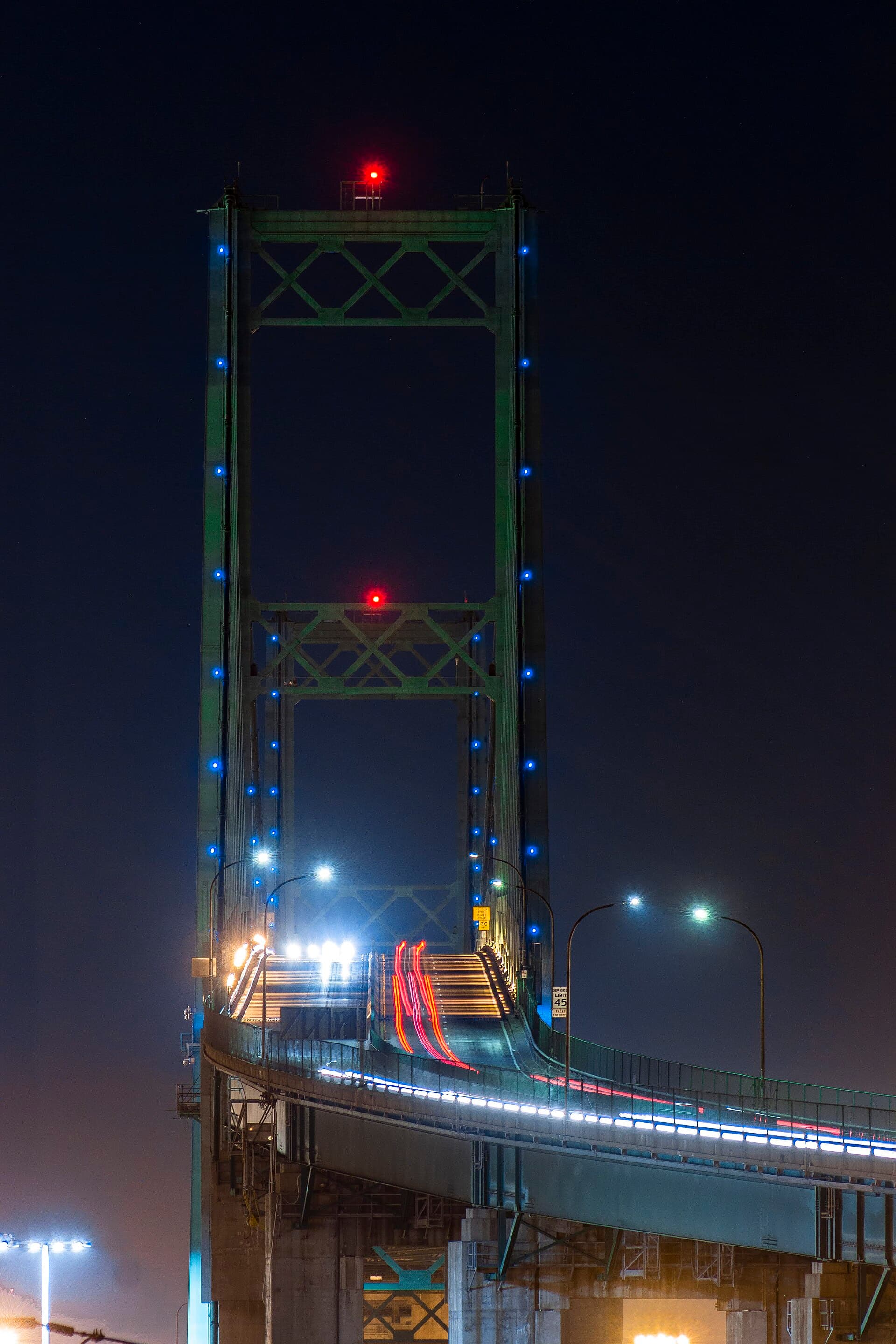 The Vincent Thomas Bridge lit at night over Los Angeles Harbor, the view below Miraleste