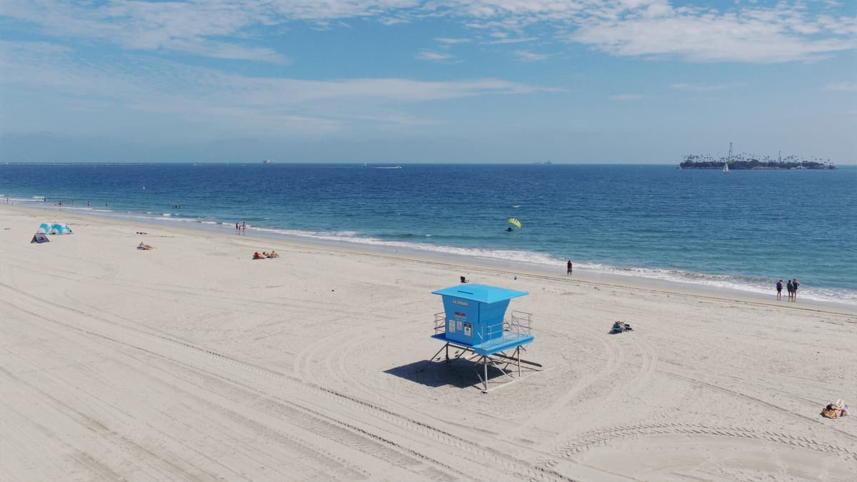 The beach at Belmont Shore in Long Beach, with a lifeguard tower on the sand