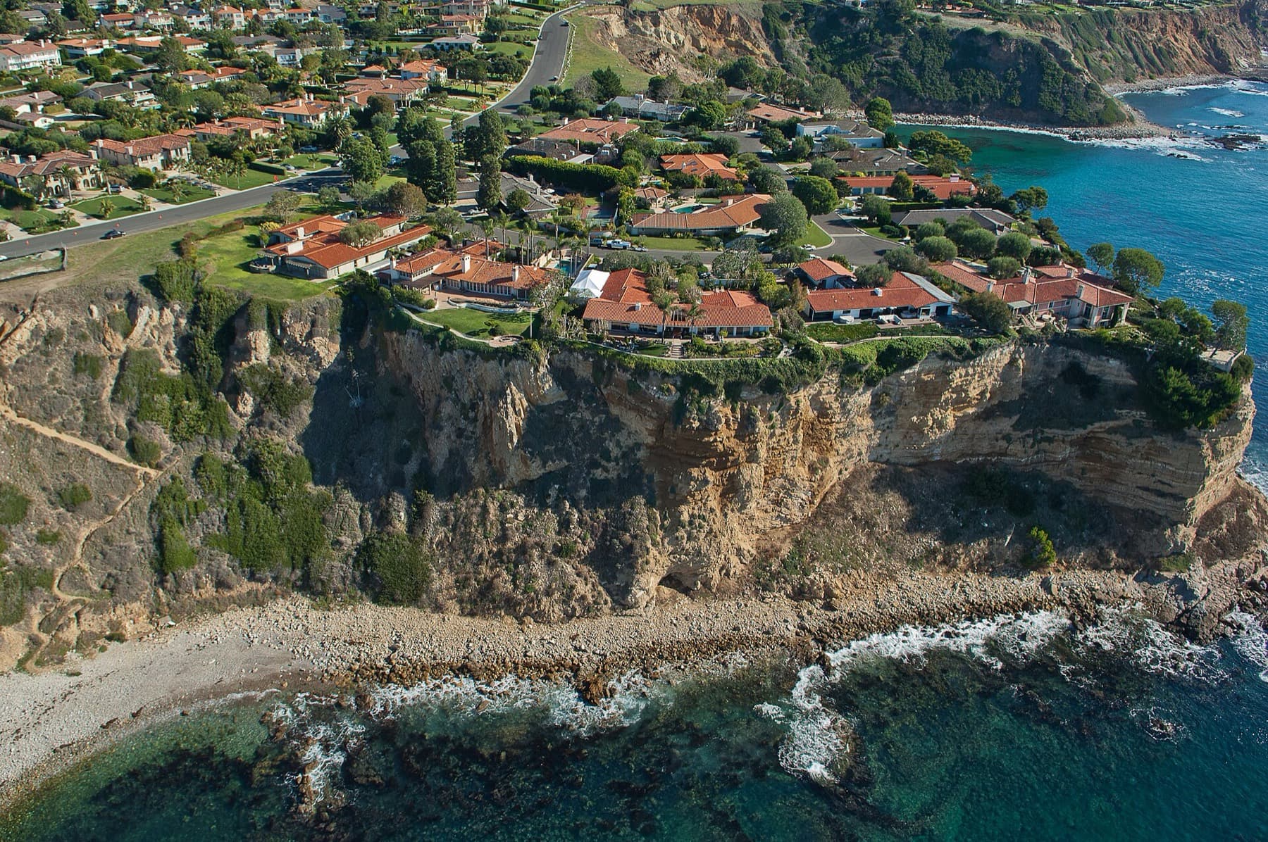 Aerial view of the Lunada Bay coastline and bluff-top homes in Palos Verdes Estates