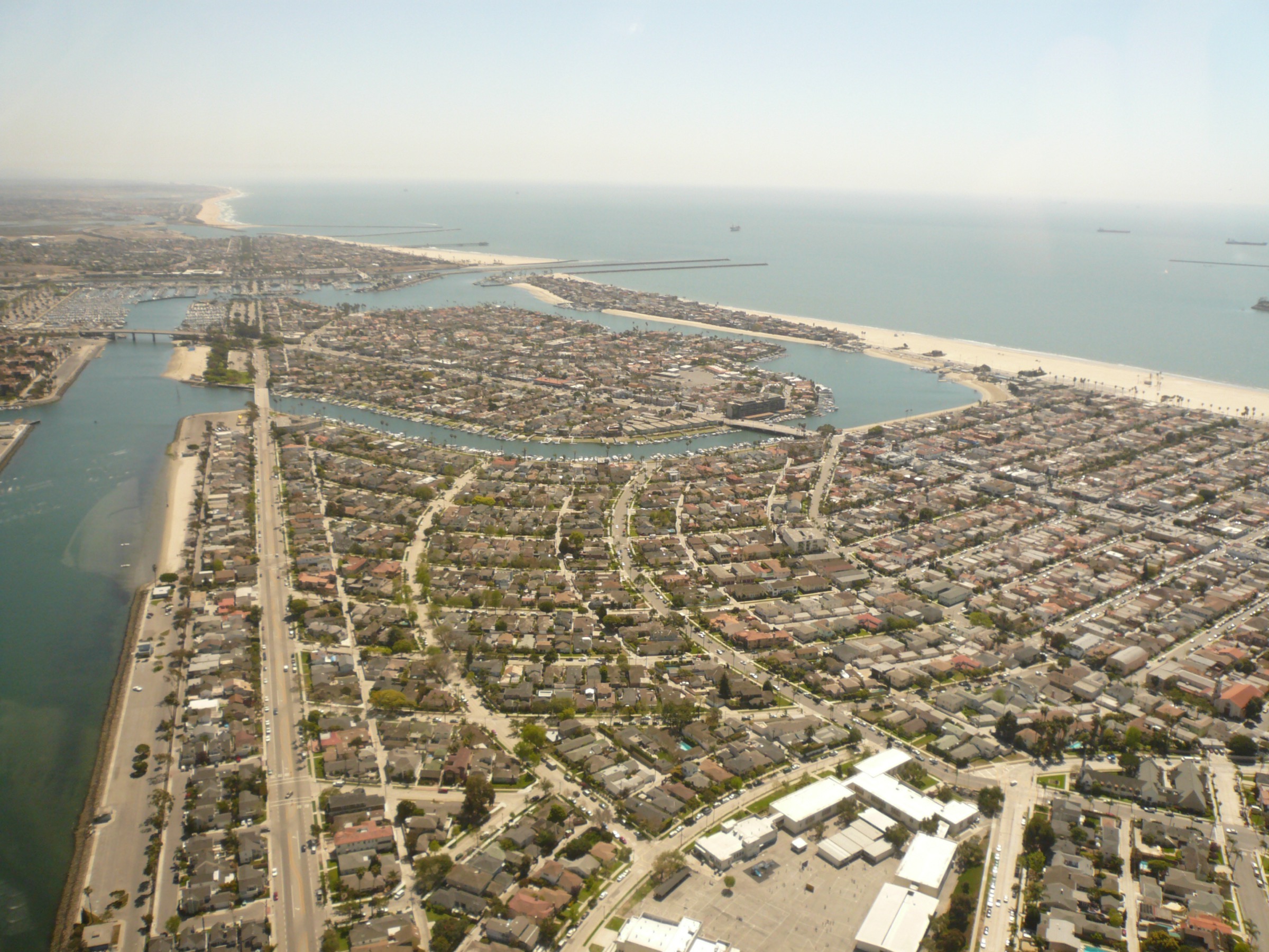 Aerial view of the Long Beach Peninsula, a narrow spit of homes between the open ocean and Alamitos Bay